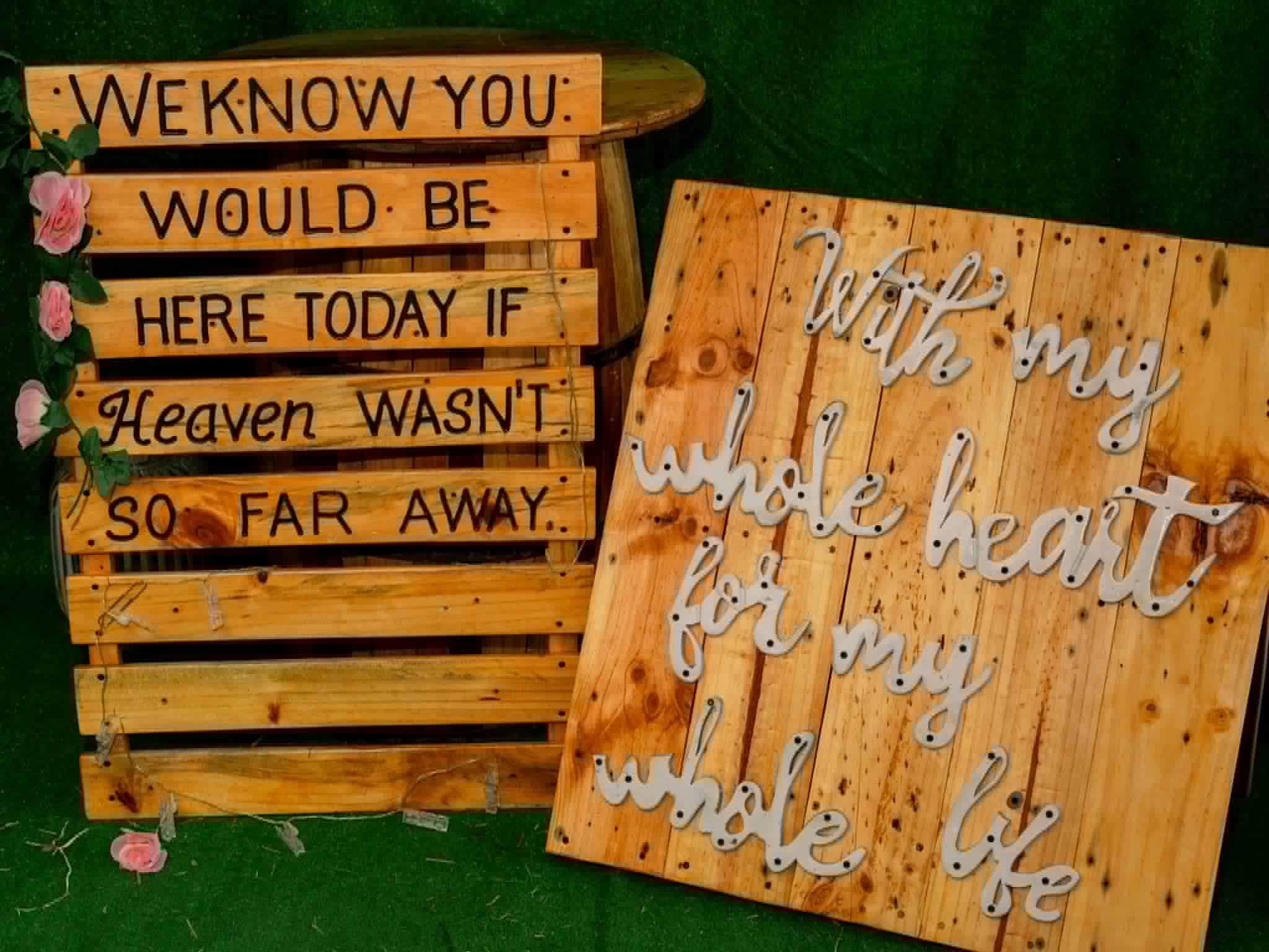 Rustic memorial and romantic wooden signs displayed together