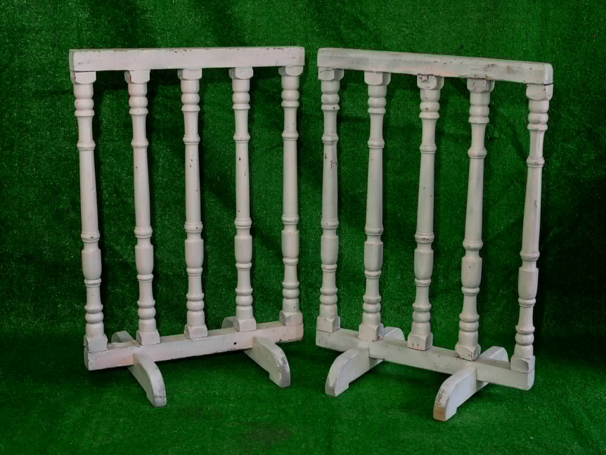 Pair of freestanding white railing-style decorative panels