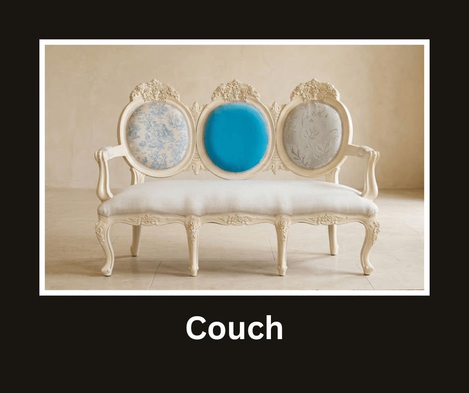 Ornate cream three-seat couch with carved white framing and blue upholstery