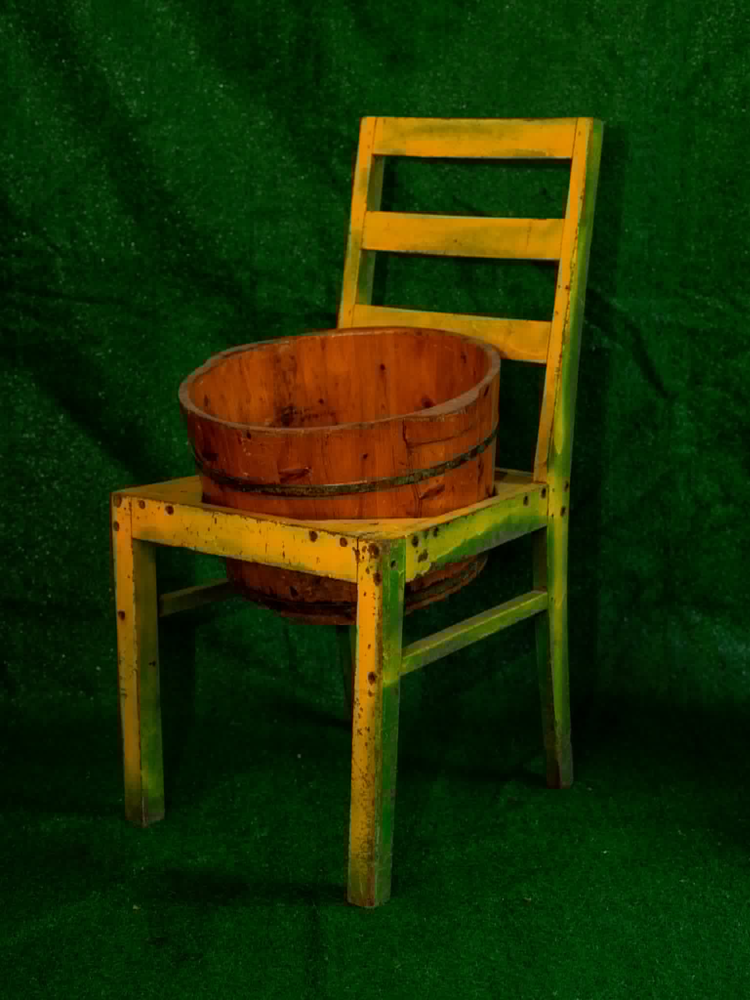 Rustic wooden chair styled with a slatted bucket