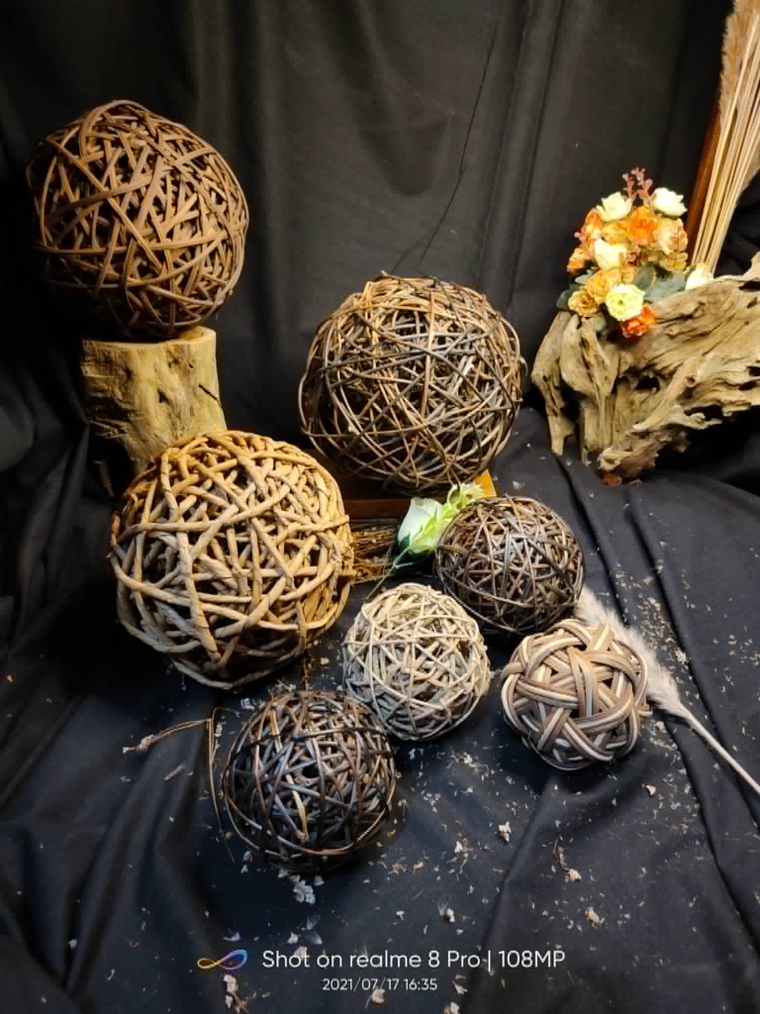 Assorted woven rattan decorative balls in natural brown tones