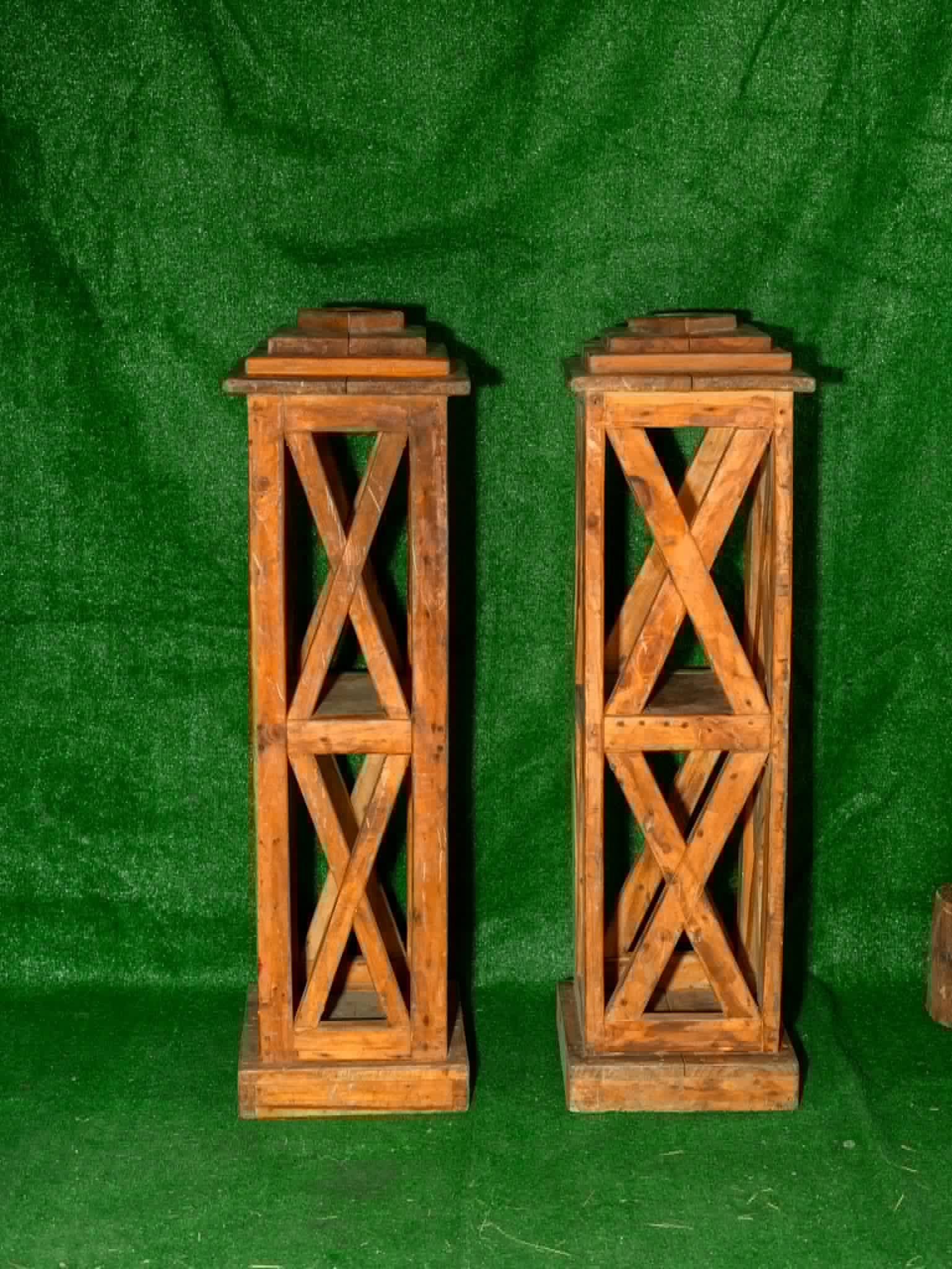 Pair of tall natural wooden lanterns with crossed side details