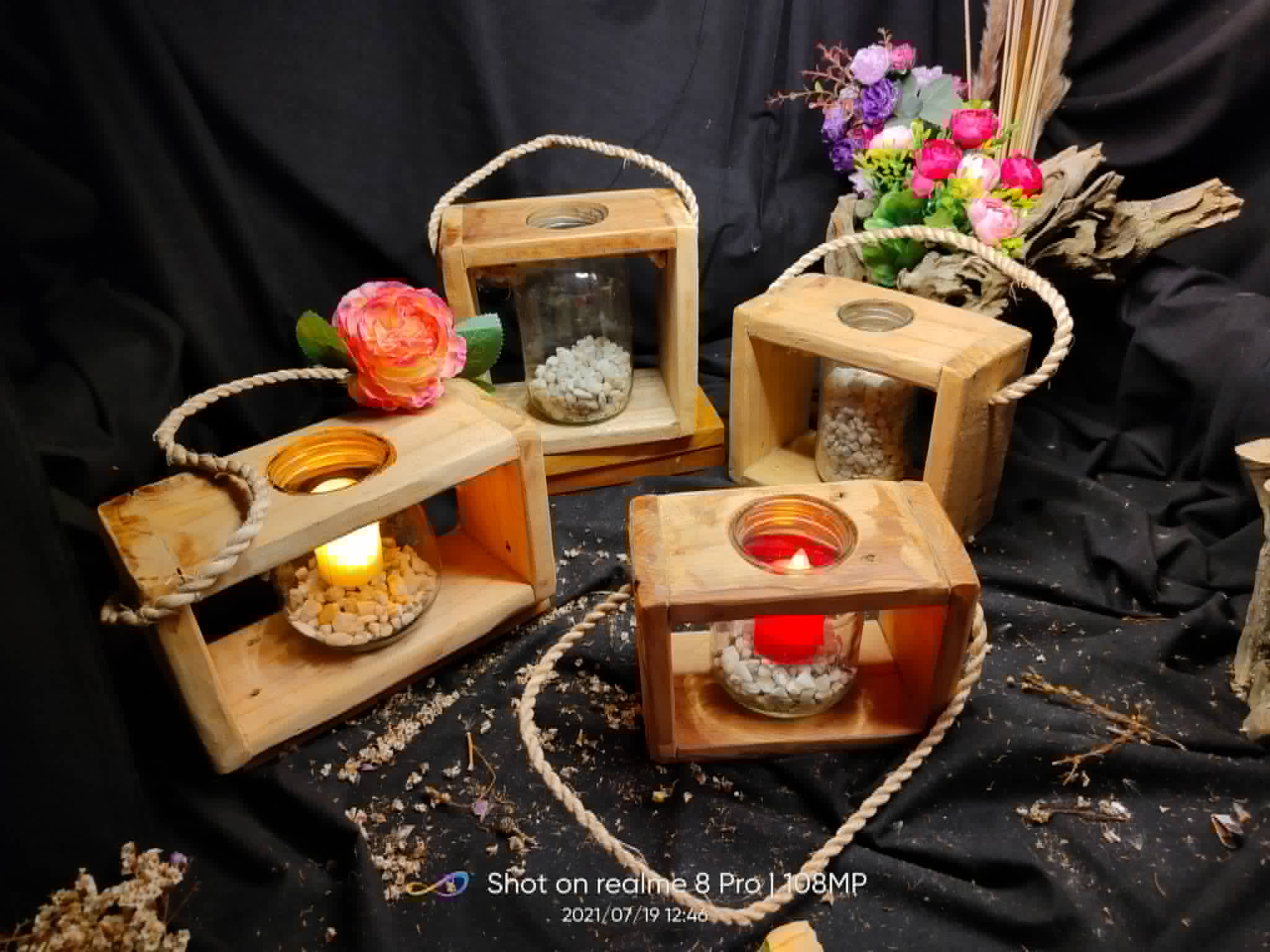 Assorted square wooden lanterns with rope handles and glass candle holders