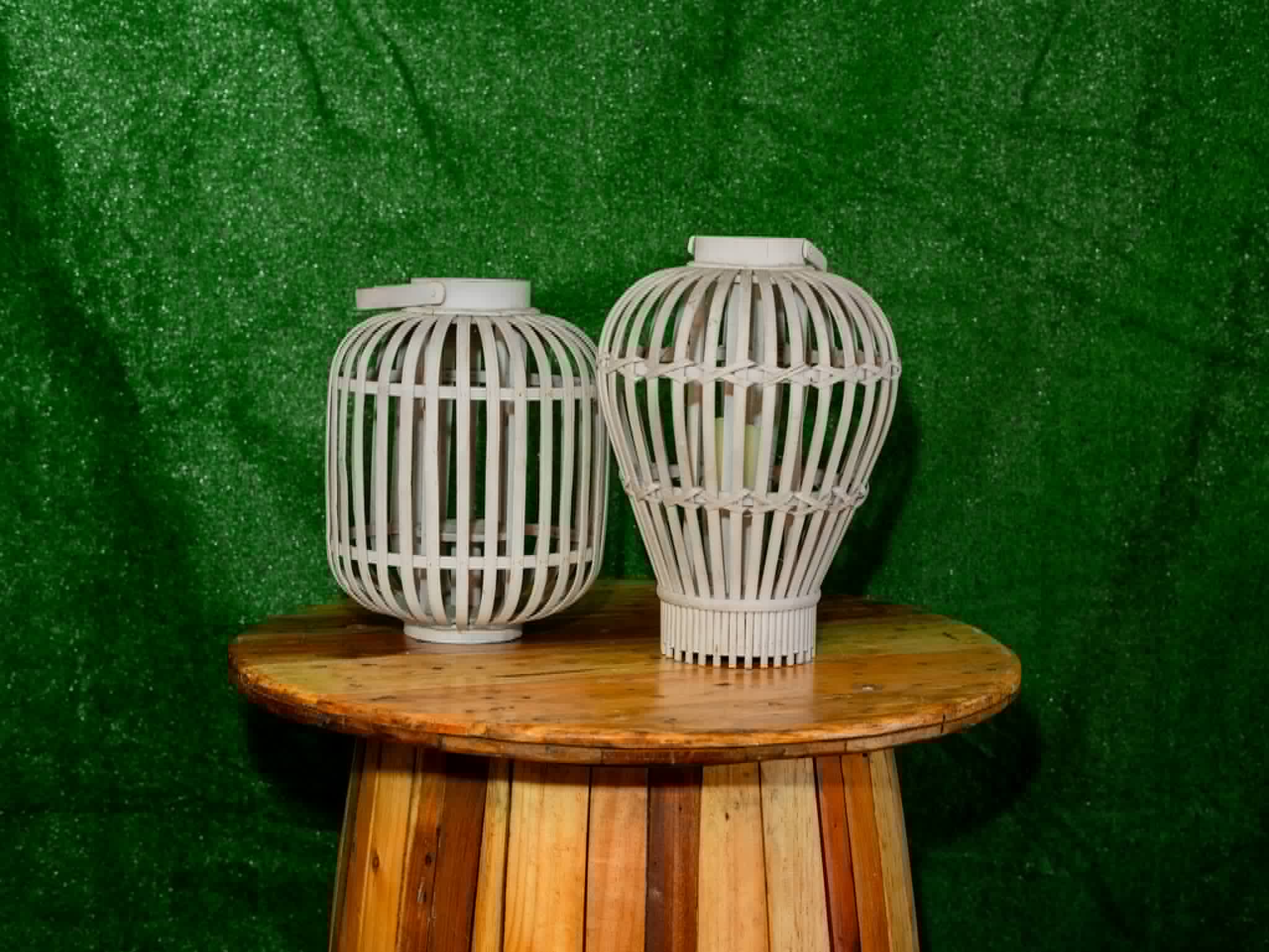 Pair of rounded white rattan lanterns in two sizes