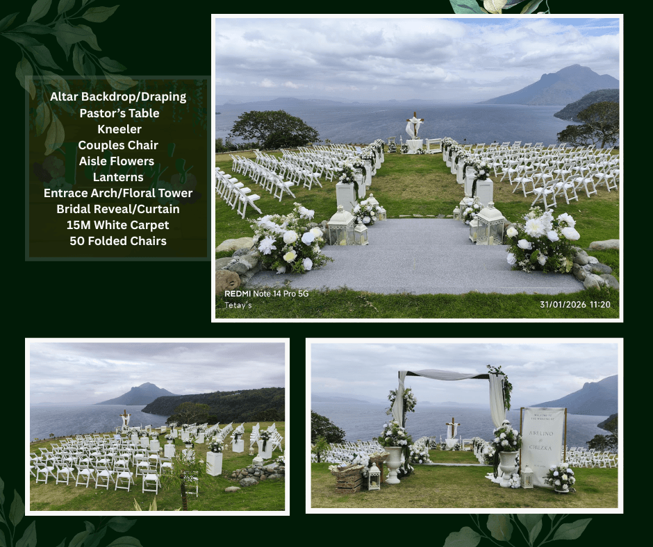 Outdoor lakeside wedding aisle with white chairs and flowers