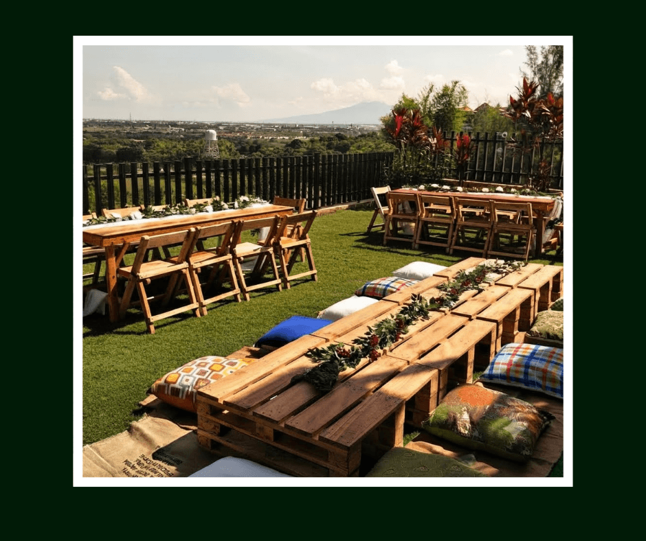 Low rustic picnic tables overlooking a mountain landscape
